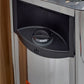 Black and silver sauna heater control panel with dial knob mounted on curved housing, installed in sauna interior