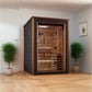 Narvik two-person indoor sauna with black exterior frame, cedarwood interior, glass door with black handles, and wooden bench