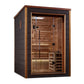 Two-person traditional sauna with cedar wood interior, dark exterior frame, glass door with black handles, built-in bench sea