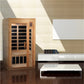Golden Designs cedar wood sauna with glass doors and black interior panels, digital control panel on side, in modern living r