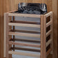 Natural wood sauna cabinet with black interior, open grill top, and multiple wooden shelves, on wood floor background