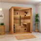 Golden Designs Osla Edition 6-person traditional sauna with cedar wood construction, glass door, and benches in spa room sett