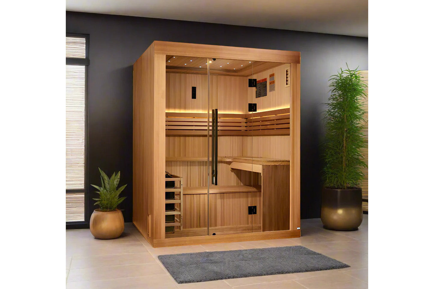 Golden Designs Osla Edition sauna with light wood construction, glass doors, built-in benches, and interior lighting in moder
