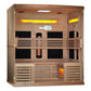 Wooden sauna cabin with full-spectrum infrared heaters, two-tier bench seating, glowing yellow heating elements, and Himalaya