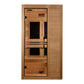 Cedar wood infrared sauna with glass door and two black benches, front view on white background
