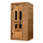 Cedar wood infrared sauna cabin with glass door, two black heating panels, wooden bench, and chrome handles on white backgrou