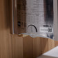 The Wall sauna instruction label showing specifications table, IPX4 rating, QR code, and technical details on white backgroun