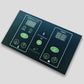 Dark teal sauna control panel with digital temperature and timer displays, green buttons and icons for power, heat, and fan c