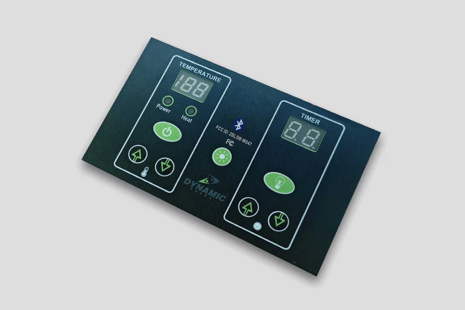 Dark teal sauna control panel with digital temperature and timer displays, green buttons and icons for power, heat, and fan c
