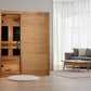 Golden Designs Toscana 3-person sauna with natural wood construction and glass door panel in modern living room setting