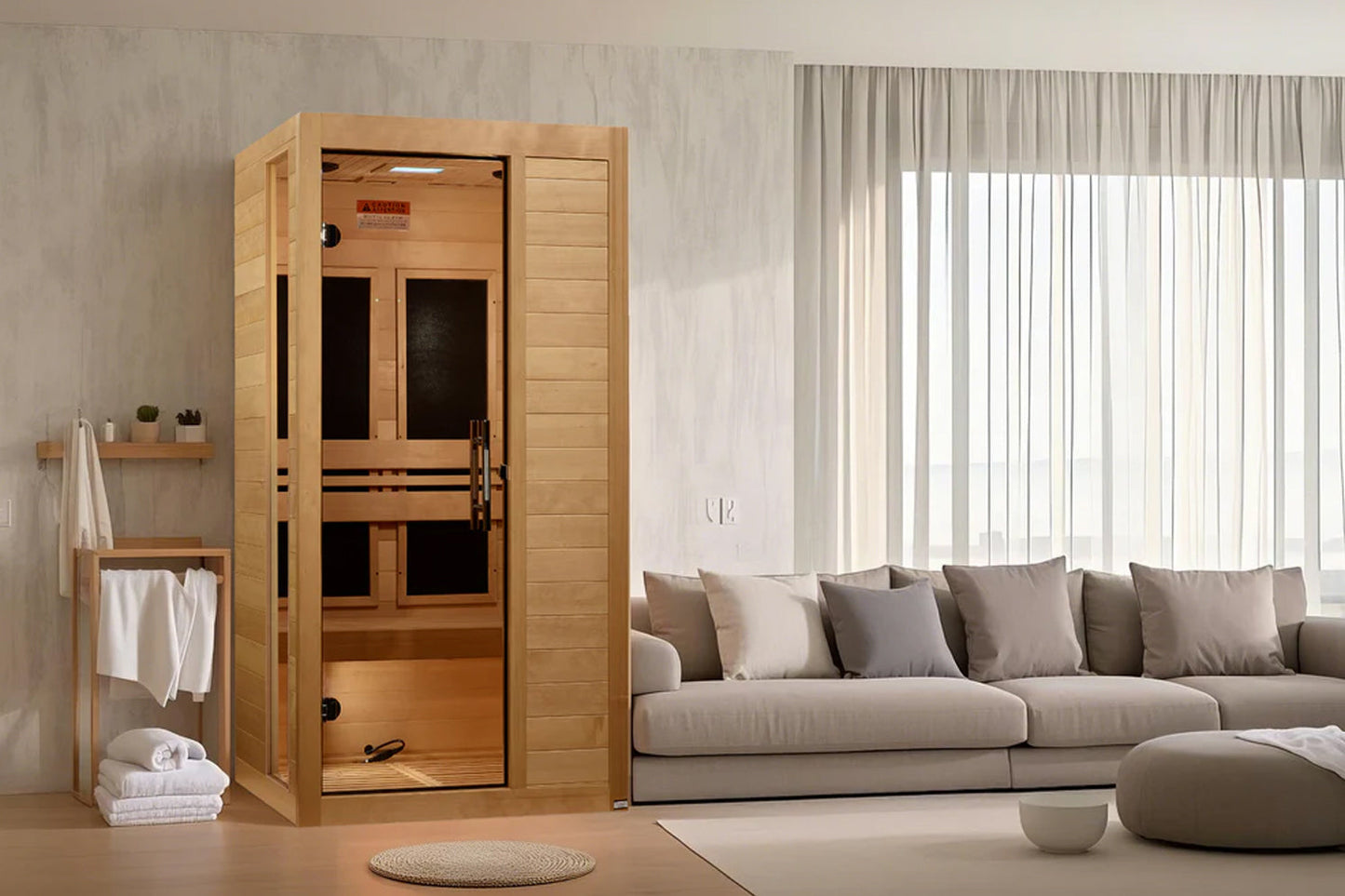 Golden Designs Veneto infrared sauna with light wood construction and dark glass doors, displayed in modern living room setti