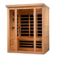 Cedar wood infrared sauna with glass front doors, orange heating elements visible inside, and control panel on left side, iso