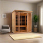 Golden Designs Vila Elite three-person infrared sauna with light wood construction and glass doors in modern bedroom setting