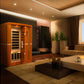 Golden Designs Vittoria 2-person infrared sauna with orange wood frame and black glass door in modern living room setting