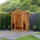 Golden Designs Vorarlberg cedar wood outdoor sauna with glass front doors and peaked roof, displayed in backyard setting