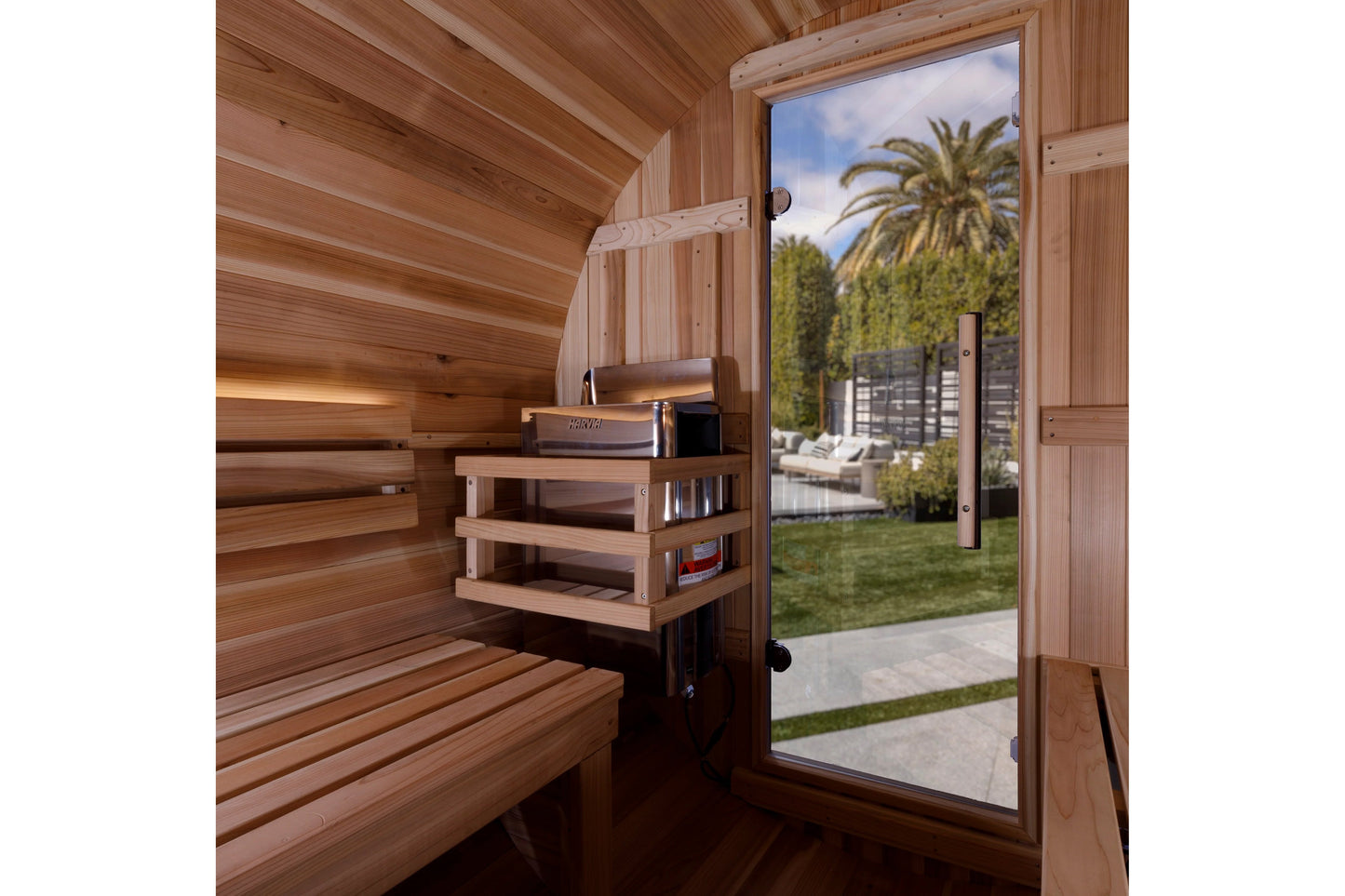 Golden Designs Zurich 4-person barrel sauna interior with cedar wood walls, bench seating, shelf storage, and glass door with