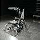 Hammer Strength assisted Nordic ham machine with silver frame, black padded seat, and dual weight plates labeled 45 lbs
