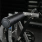 Black padded handlebar with circular button on exercise machine, close-up detail view