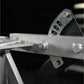 Hammer Strength Assisted Nordic Ham lever arm detail with metal bracket and adjustment pegs on black background