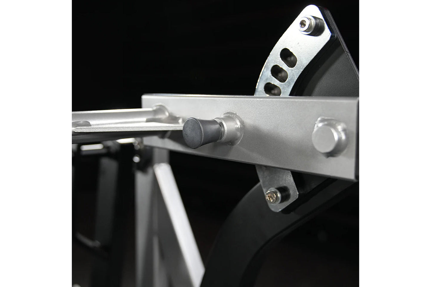 Silver and black assisted Nordic ham machine with adjustable lever and metal frame on black background