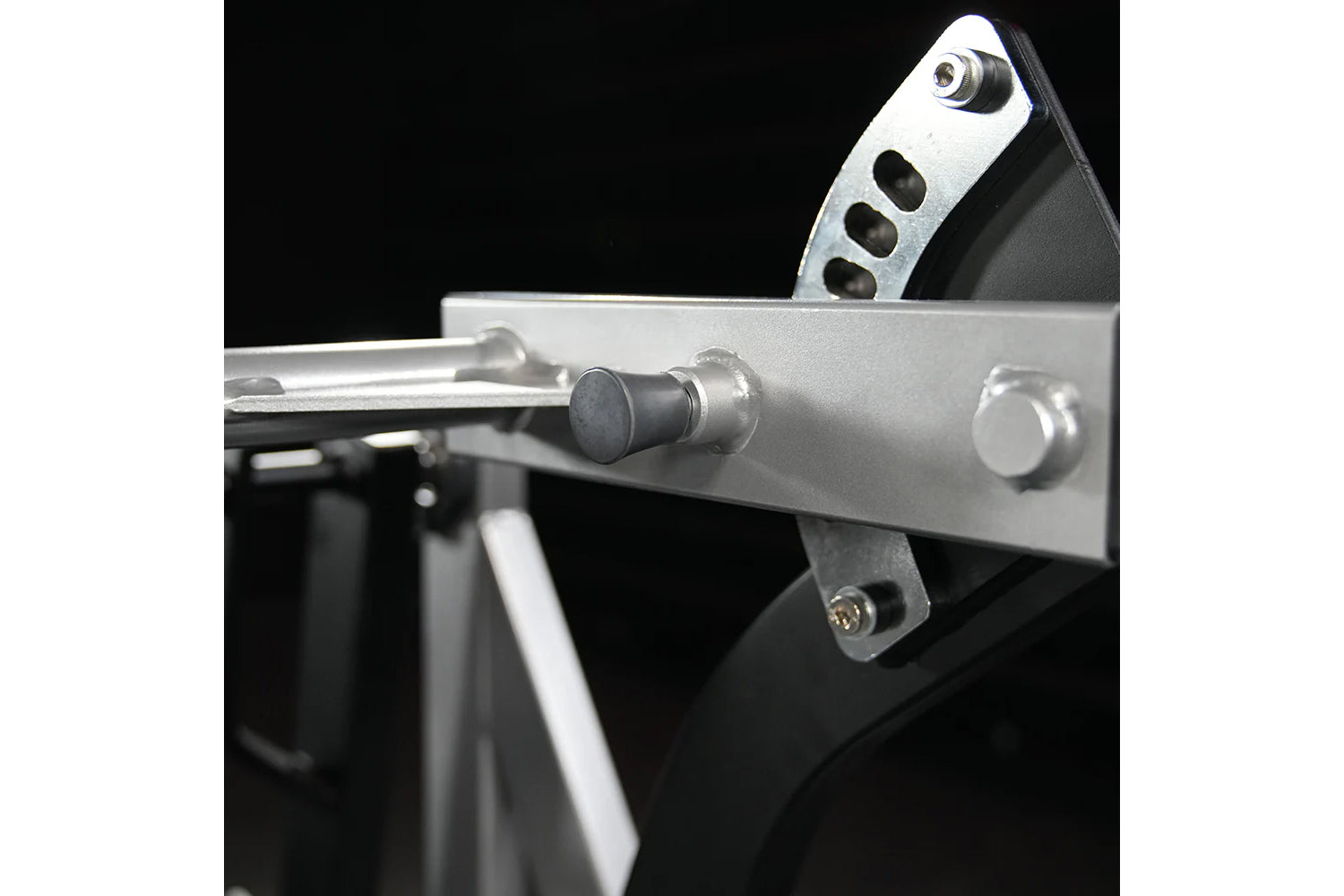 Silver and black assisted Nordic ham machine with adjustable lever and metal frame on black background