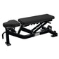 Hammer Strength black athletic multi-adjustable weight bench with padded seat and backrest on white background