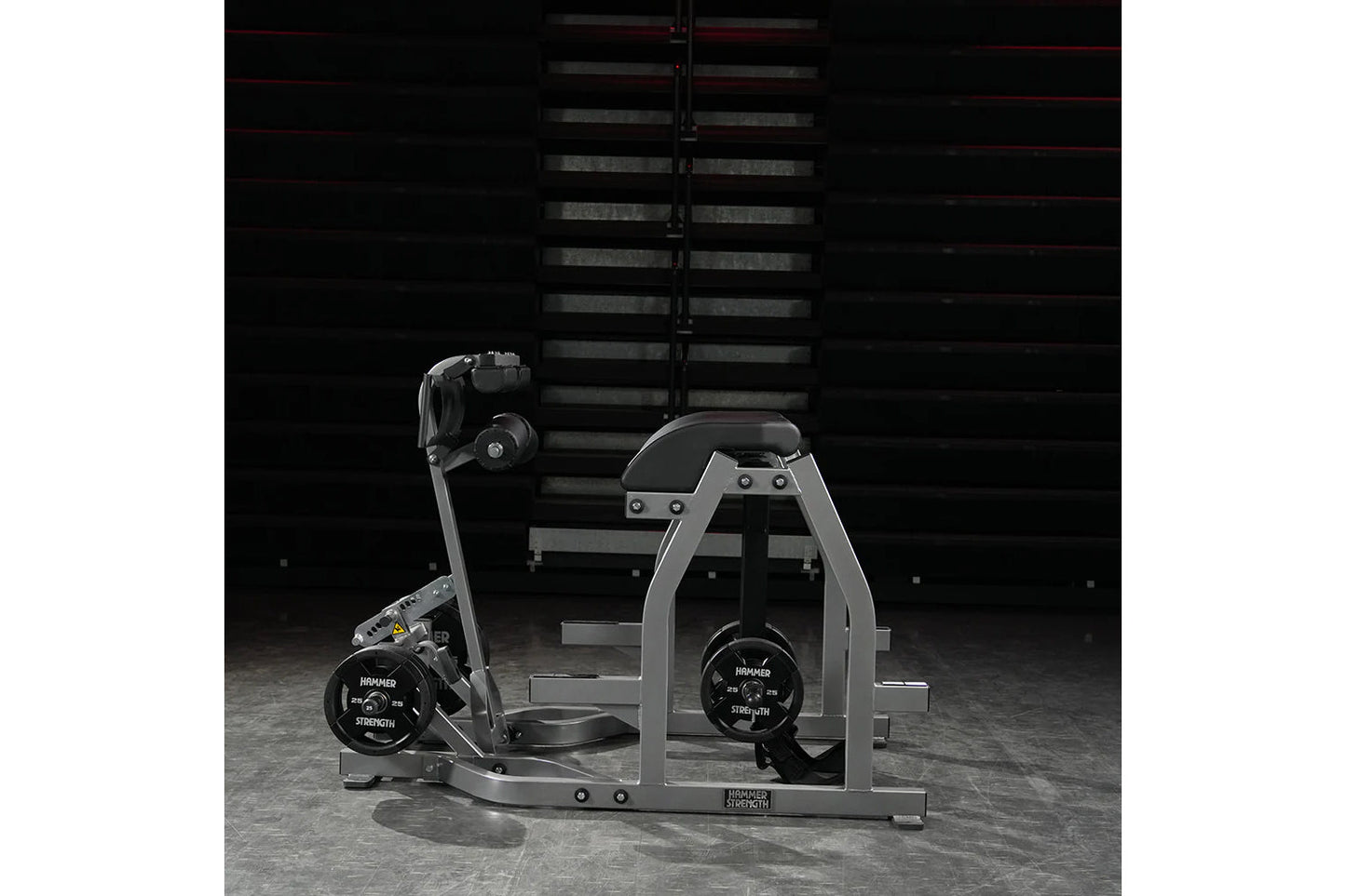 Hammer Strength gray and black glute-ham reverse hyper combo machine with weight plates, in industrial gym setting