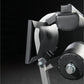 Black and gray exercise machine with padded leather seat, leg extension attachment, and control dial on black background