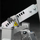 Silver metal fitness machine component with adjustment lever, ventilation slots, chrome bolts, and yellow caution warning lab