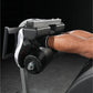 Black and gray leg press machine with padded foot platform and adjustable seat, worn by model on dark background