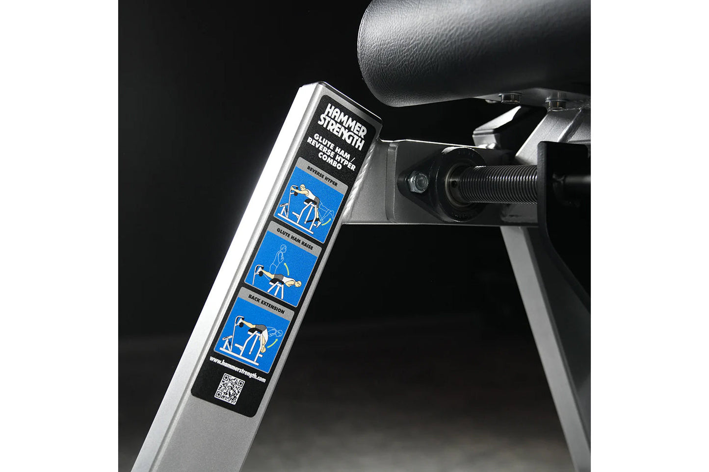 Hammer Strength Glute-Ham Reverse Hyper Combo bench machine with instruction label and adjustment mechanisms on black backgro