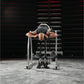 Athlete performing reverse hyper exercise on silver and black Hammer Strength gym machine in industrial warehouse setting