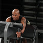 Man using black Hammer Strength Glute-Ham Reverse Hyper Combo Bench Machine in gym setting, wearing black sleeveless tank top