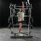 Male athlete wearing light gray t-shirt and dark shorts using Hammer Strength Ground Base Jammer machine with loaded barbells