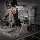 Man performing overhead press with loaded barbell on silver and black Hammer Strength jammer machine in gym setting