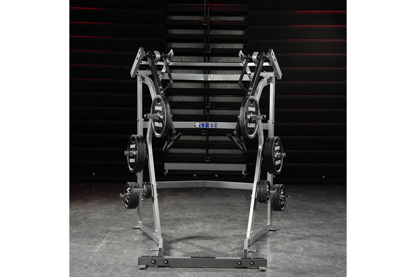 Hammer Strength Ground Base Jammer with silver frame, black weight plates, and dual handles in gym setting