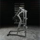 Hammer Strength Ground Base Jammer machine with silver and black frame on concrete floor against dark brick wall background