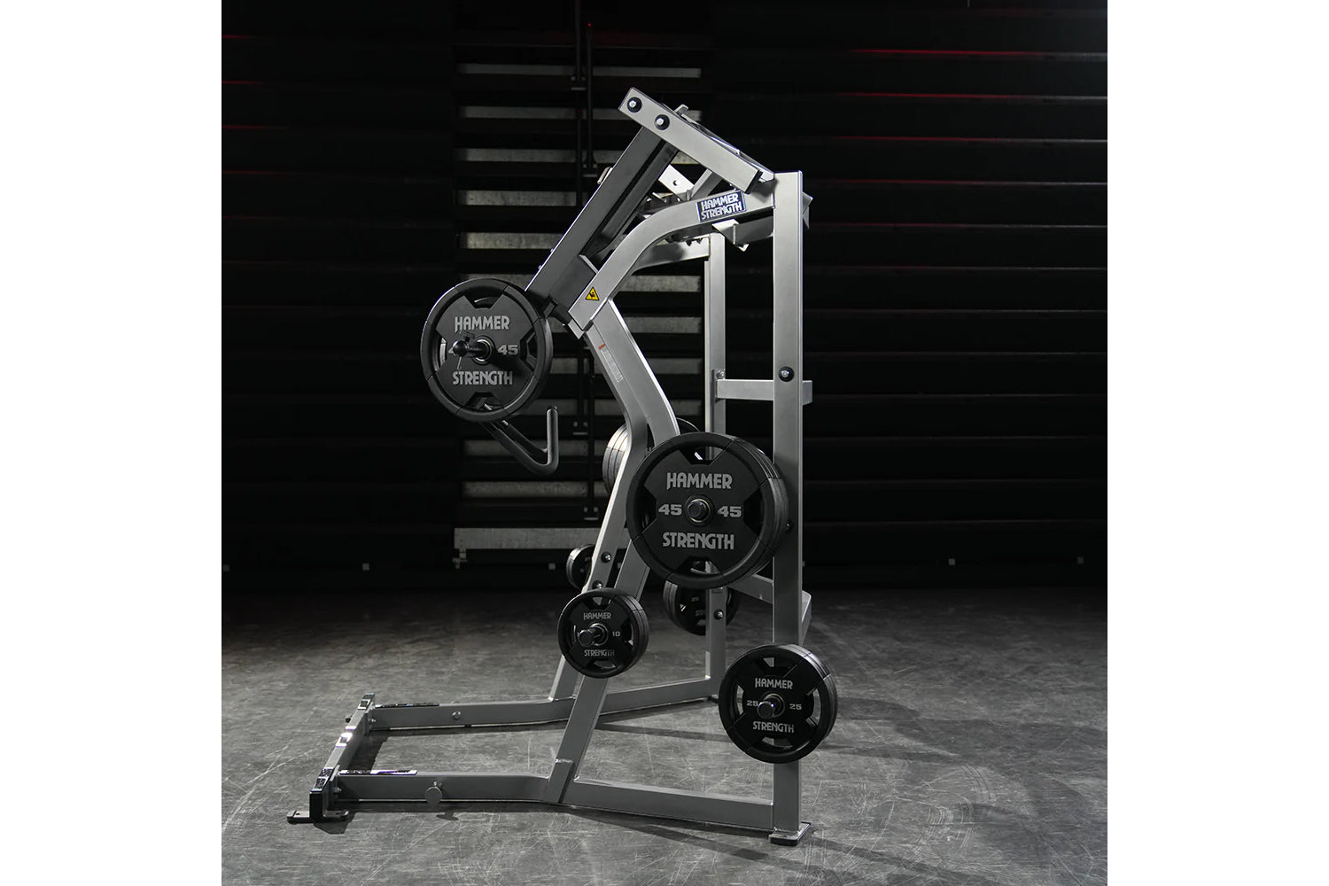 Hammer Strength Ground Base Jammer with silver frame and black weight plates loaded on machine in gym setting