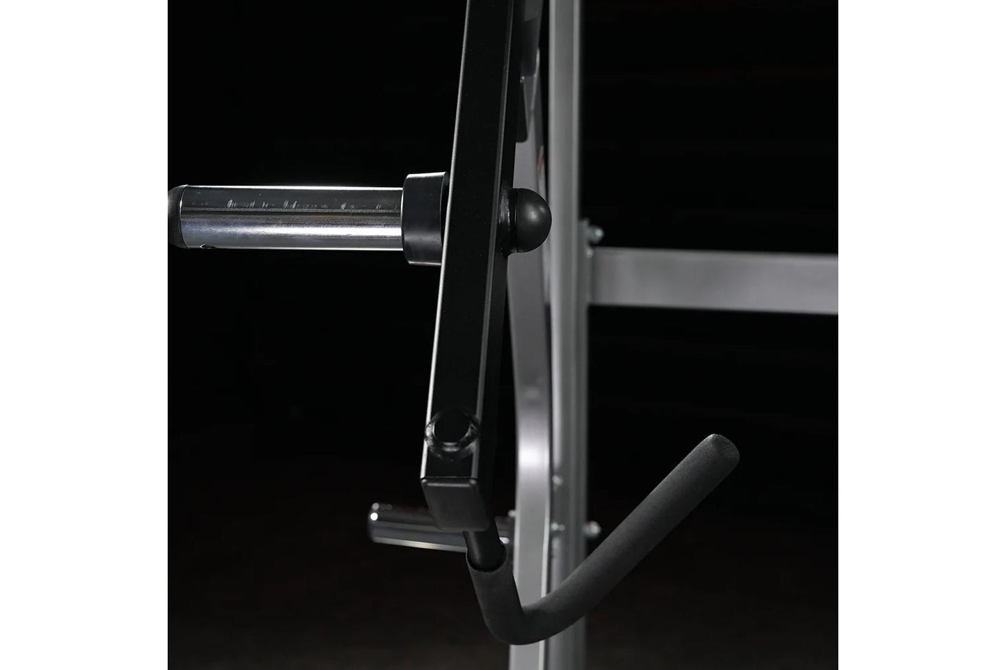 Hammer Strength Ground Base Jammer with chrome bar and black handle attachment on dark background