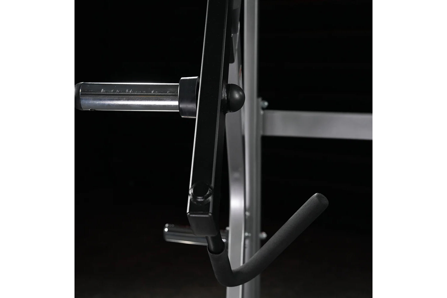 Hammer Strength Ground Base Jammer with chrome bar and black handle attachment on dark background
