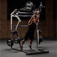 Man performing shoulder press on Hammer Strength black and silver jammer machine with weight plates