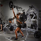 Woman using Hammer Strength jammer machine with loaded weight plates in a gym setting