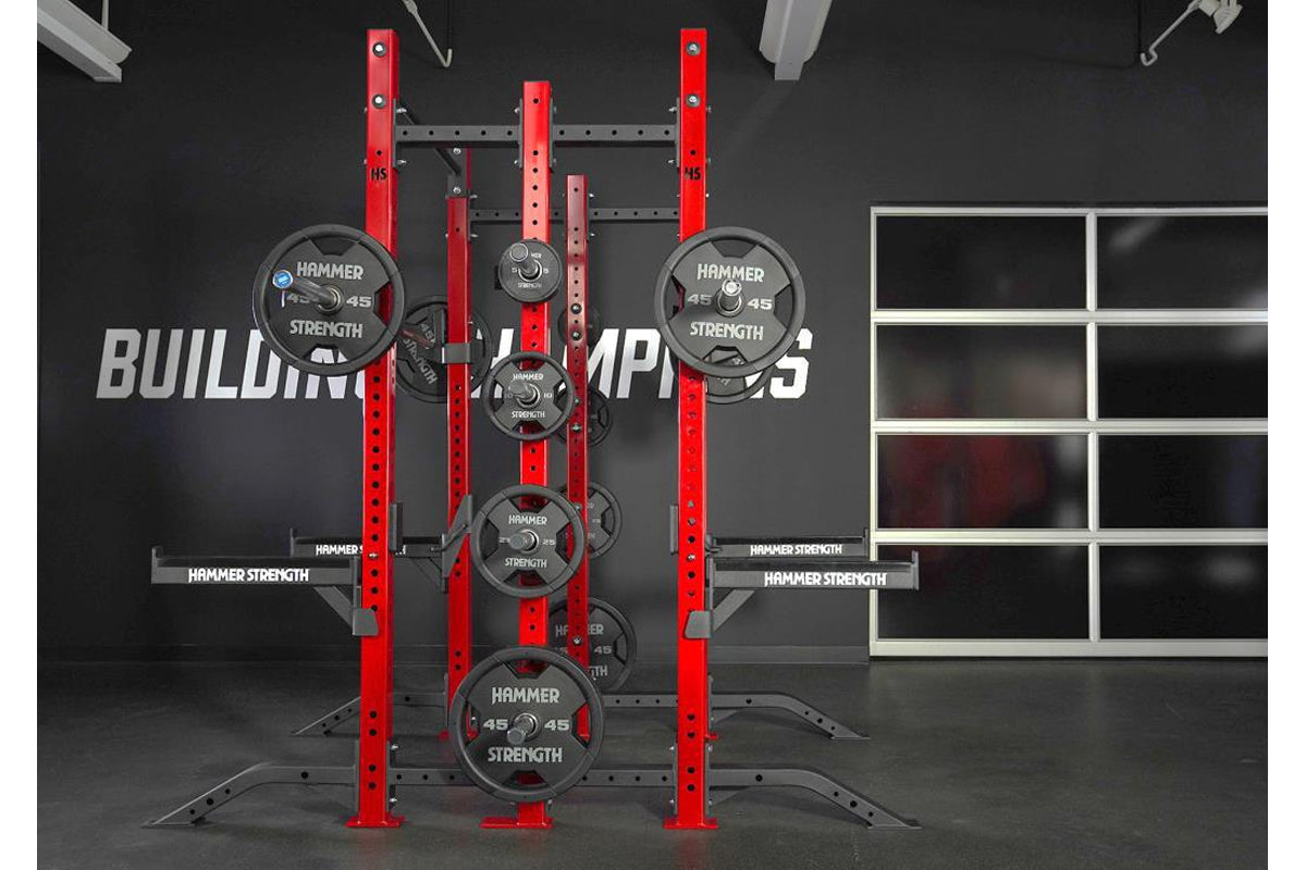 Hammer Strength HD Athletic NX Half Half Combo Rack with red uprights, gray perforated horizontal beams, and multiple black w