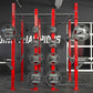 Hammer Strength red and gray half rack combo with weight plates loaded on pegs in gym setting