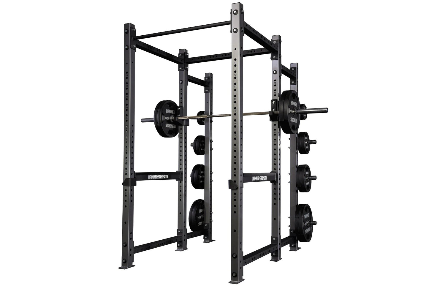 Black metal power rack with adjustable squat and bench stations, loaded with black weight plates, on white background