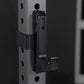 Black metal squat stand attachment mounted on vertical rail with adjustment holes, front angle view