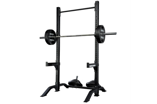 Black Hammer Strength squat stand with vertical posts, horizontal bar, weight plates labeled 45 lbs, and adjustable safety ar