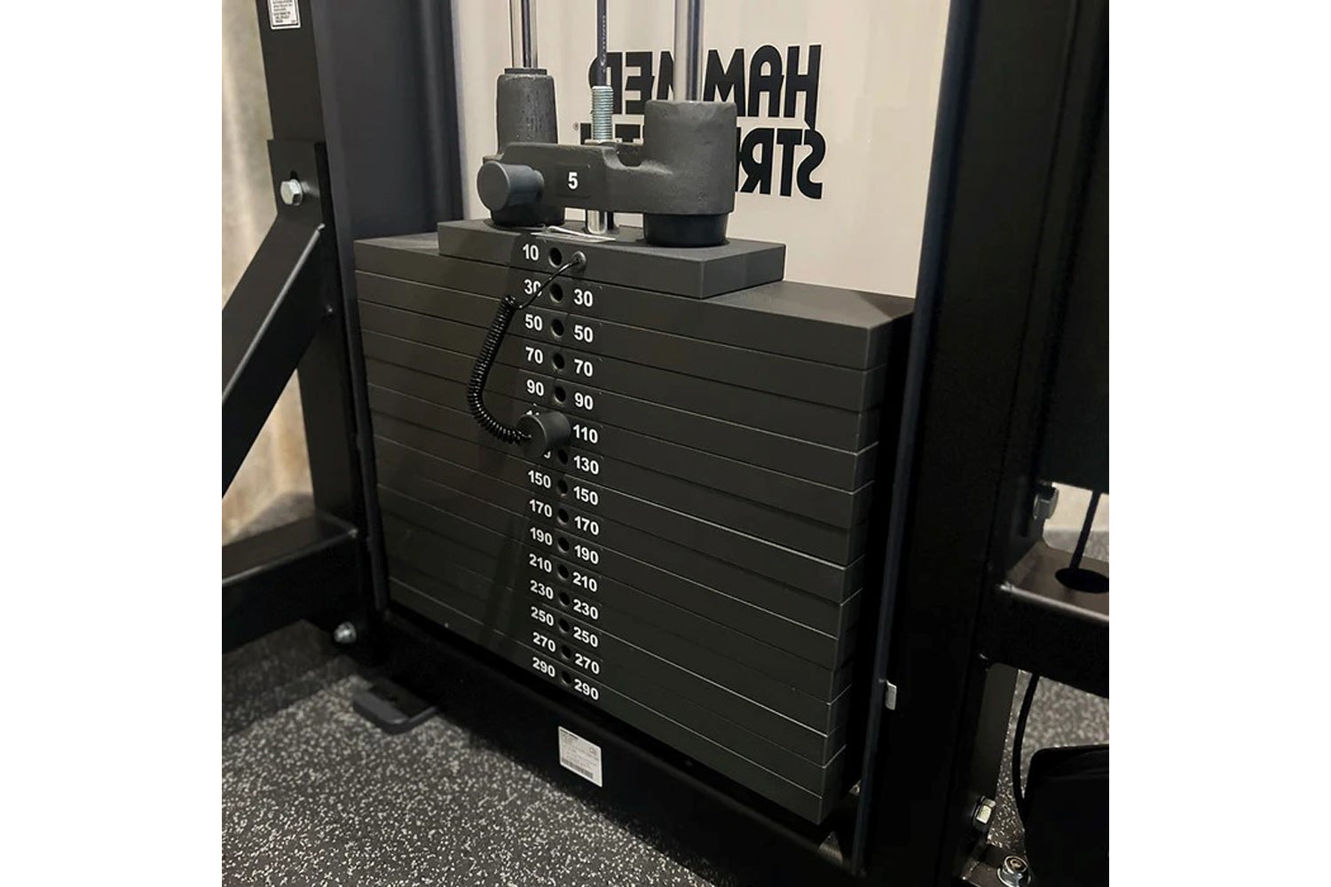 Black Hammer Strength HD Elite dual pulldown row machine with numbered weight stack from 10 to 290 pounds, shown in gym setti