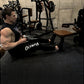 Man using black Hammer Strength HD Elite Dual Pulldown Row machine with cable attachment in gym setting with weight equipment