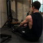 Man using black and wood Hammer Strength HD Elite Dual Pulldown Row machine in gym setting, demonstrating lat pulldown exerci